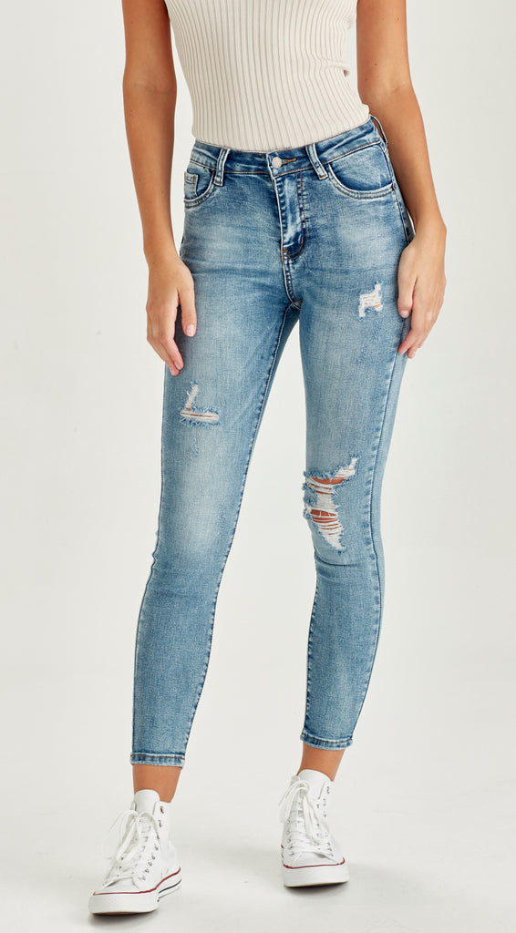 ripped skinny mid length blue jean